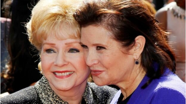 Debbie Reynolds (left) died a day after her daughter Carrie Fisher