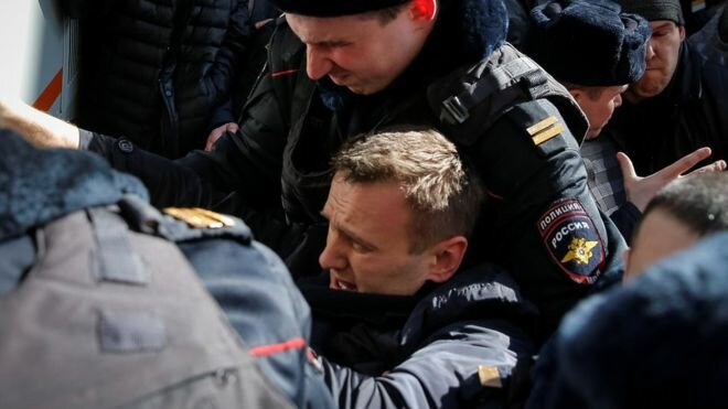 Alexei Navalny was taken by police officers during a rally in central Moscow